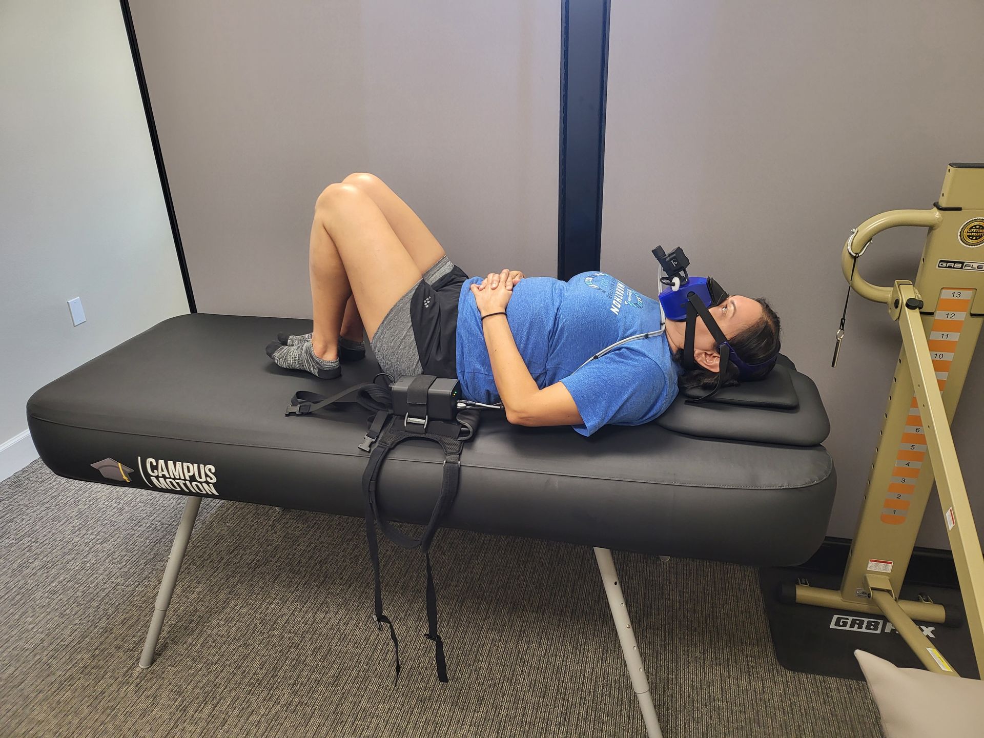 A woman standing still in front of the 3D cameras of KinetiSense during a balance screening. This technology aids in creating a Tailored Treatment plan by identifying specific balance issues and symptoms, which accelerates recovery and reduces the risk of long-term complications.