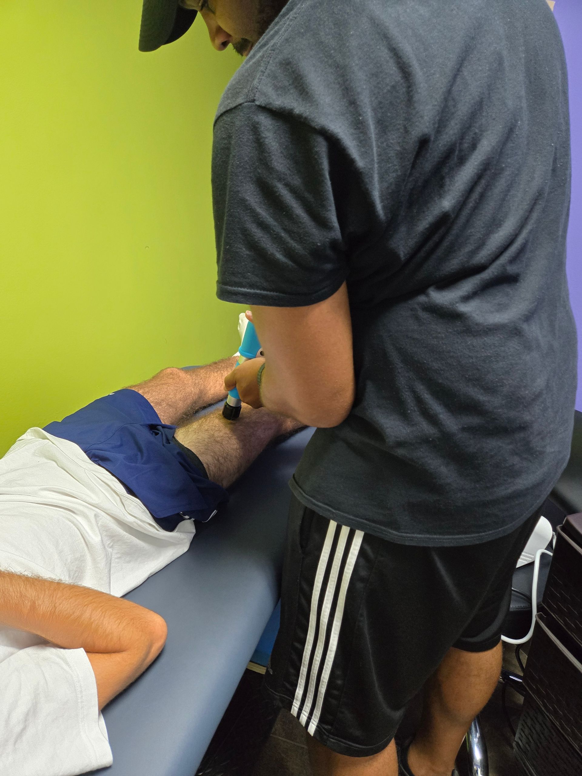 A woman standing still in front of the 3D cameras of KinetiSense during a balance screening. This technology aids in creating a Tailored Treatment plan by identifying specific balance issues and symptoms, which accelerates recovery and reduces the risk of long-term complications.
