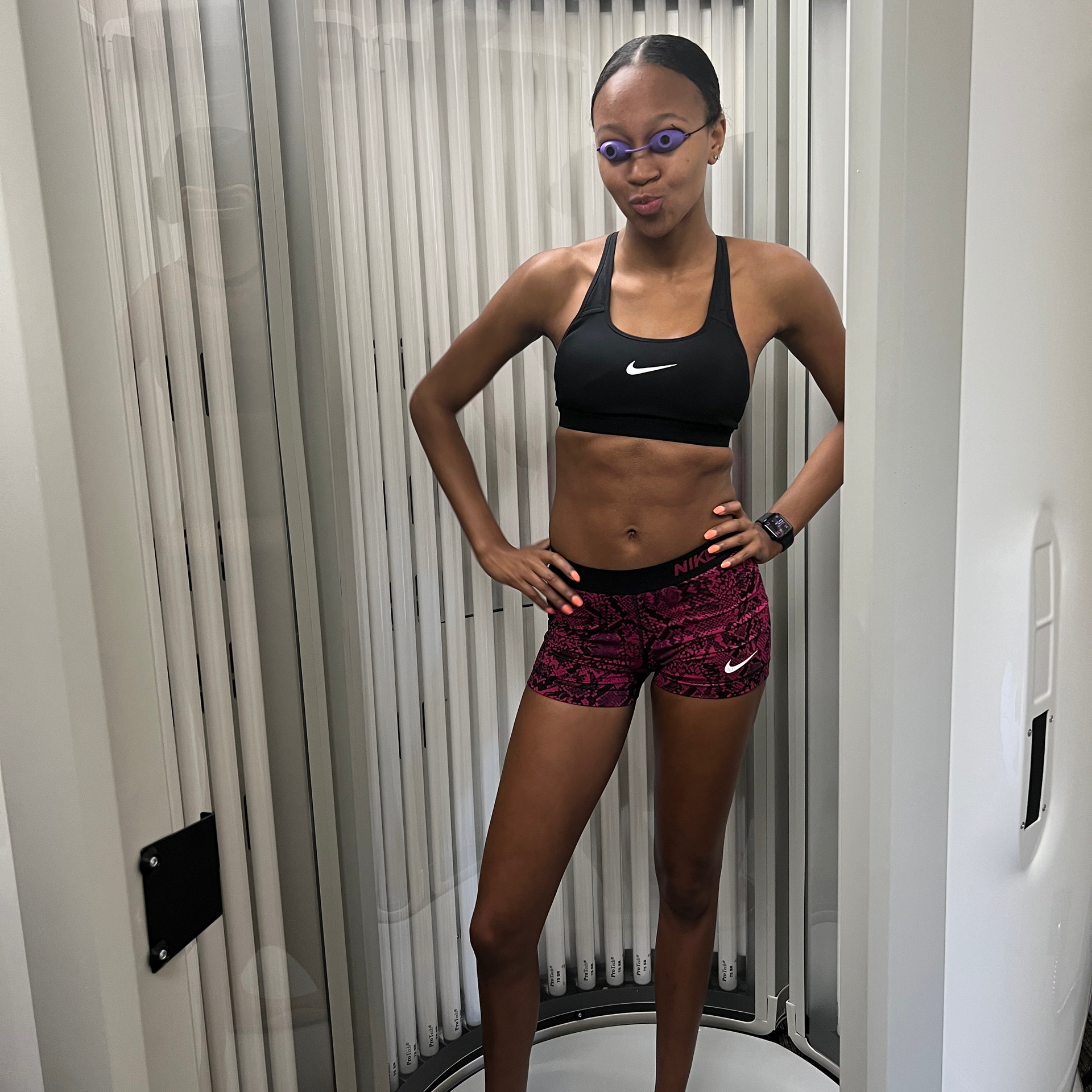 A woman about to enter a Red Light Therapy chamber as part of her Pain Management strategy. Red Light Therapy increases blood circulation and reduces oxidative stress, offering effective relief for joint pain, muscle soreness, inflammation, and various pain-related conditions, such as arthritis, headaches, or post-exercise discomfort.