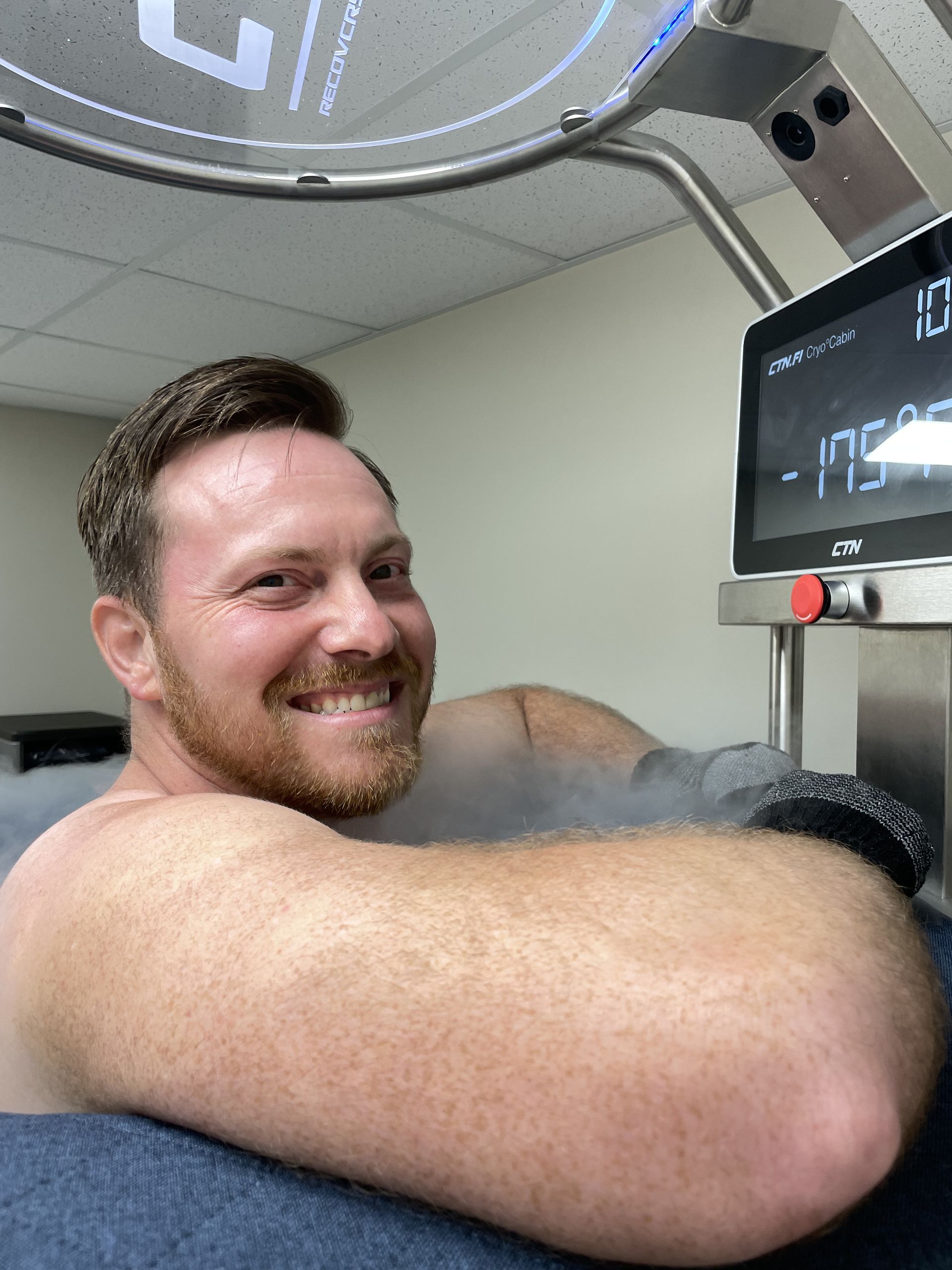 Man experiencing cold exposure in a cryotherapy chamber, where the therapy can enhance mood and energy levels by triggering the release of endorphins.