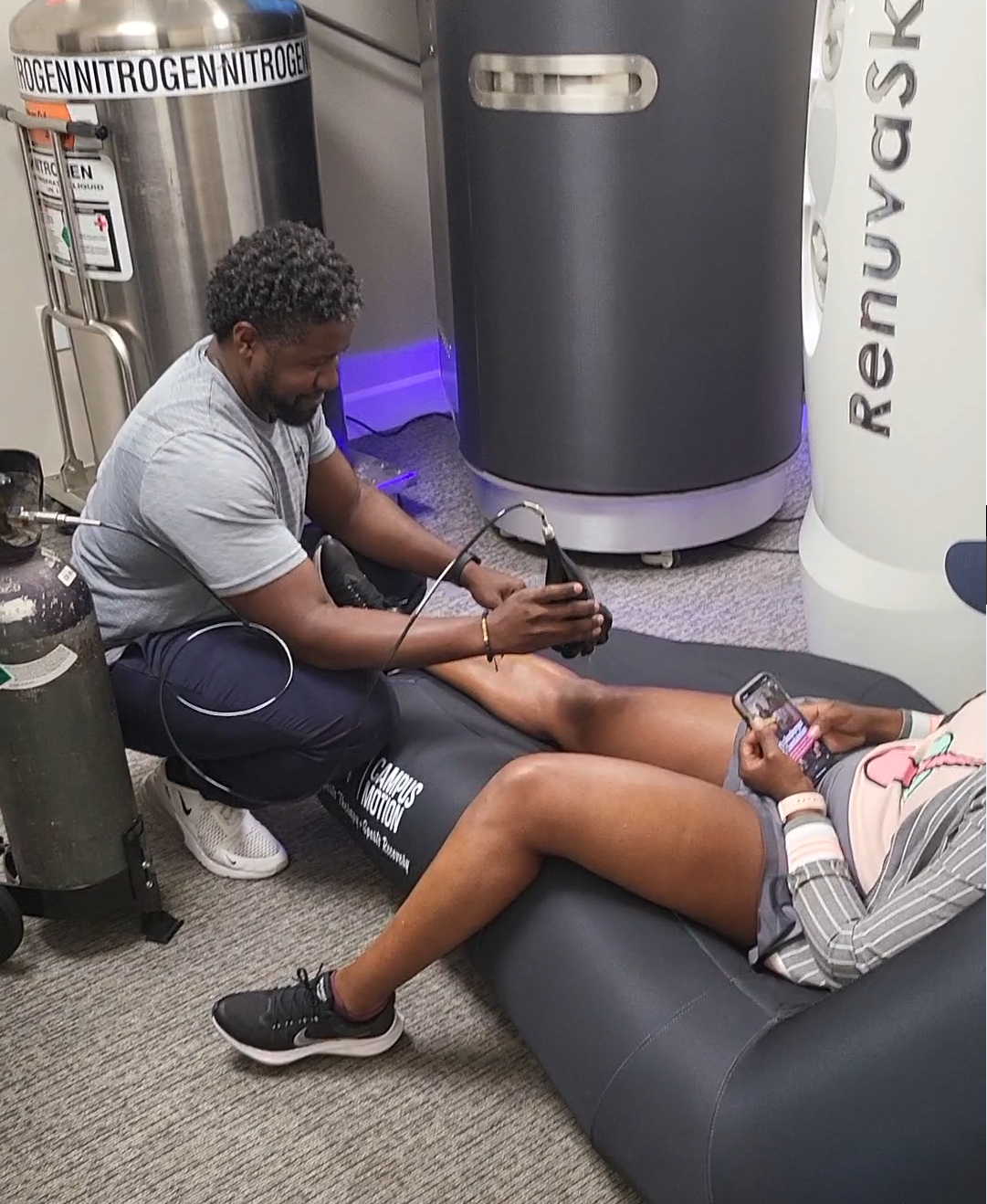 A physical therapist providing a patient with local cryotherapy treatment, contributing to Improved Skin Health and aiding in quicker recovery for athletes and active individuals by reducing muscle soreness and promoting targeted blood flow.