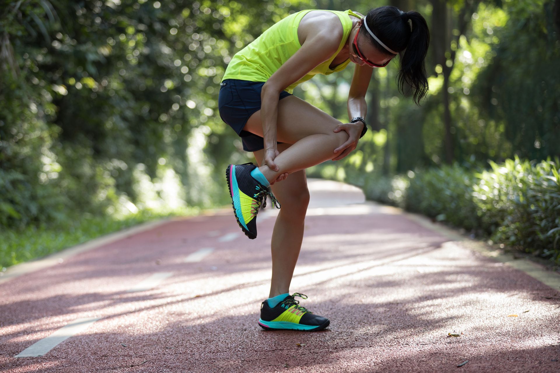 woman runner has shin splints pains while running