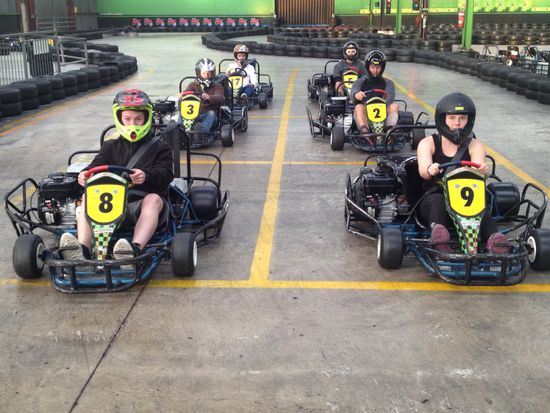 Group of people is driving go kart car