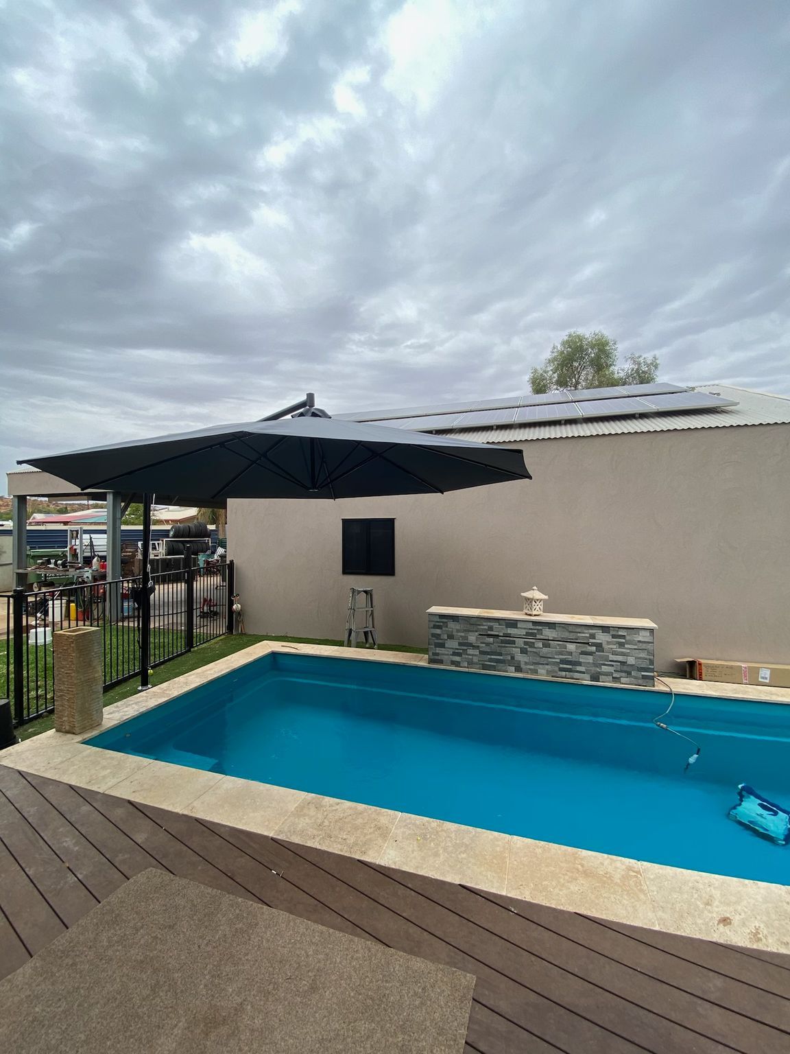 Two Umbrellas Over A Pool With Bush Around It  — Shadetech in Alice in Ciccone, NT
