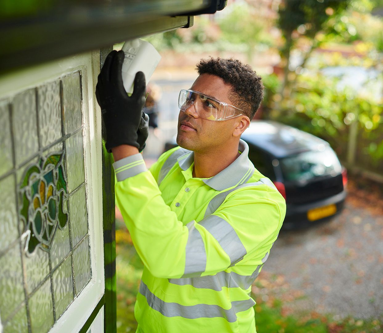 Expert installing a CCTV camera at a residential property Expert installing a CCTV camera at a residential property