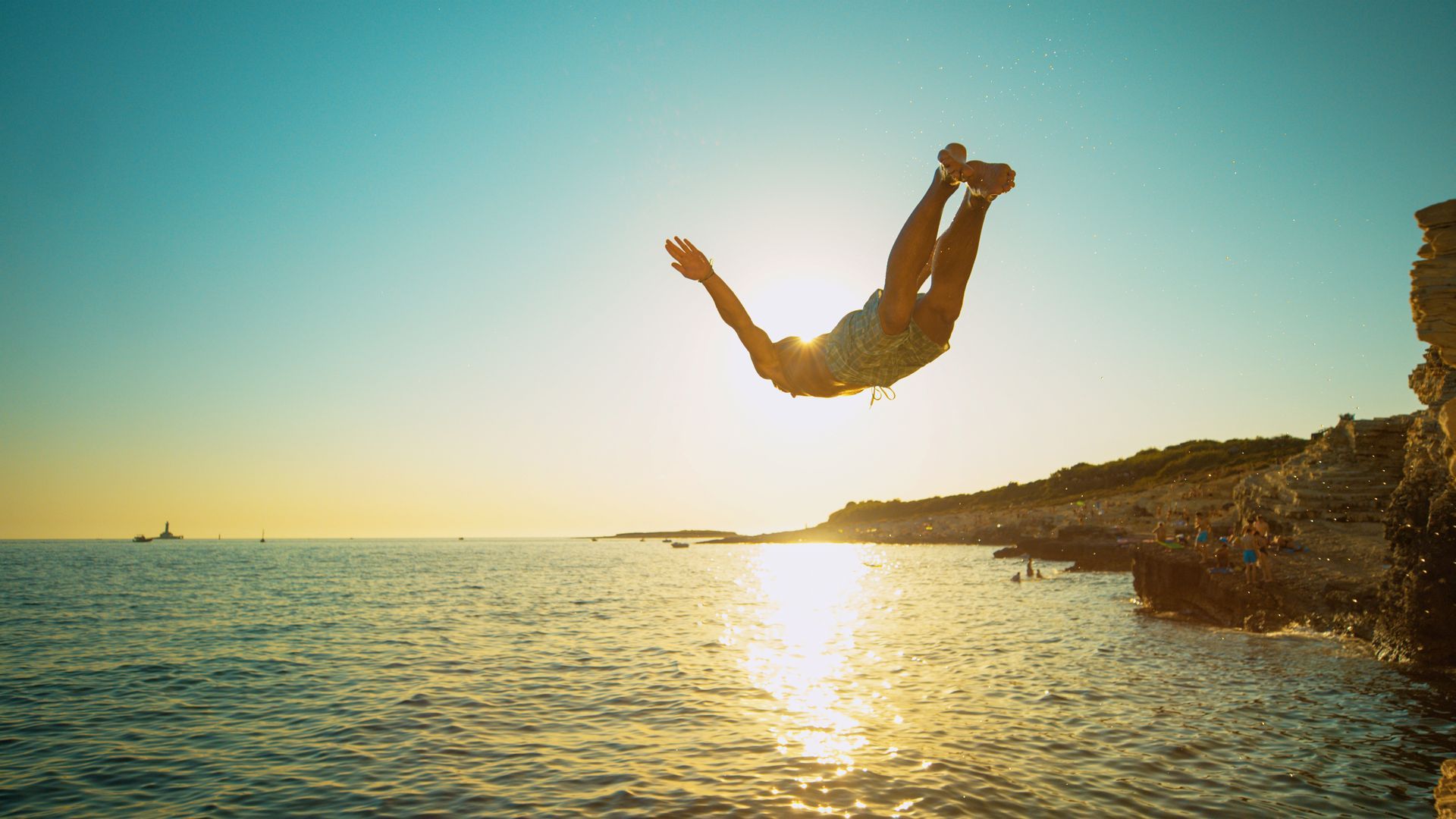 Man jumping in cold water 