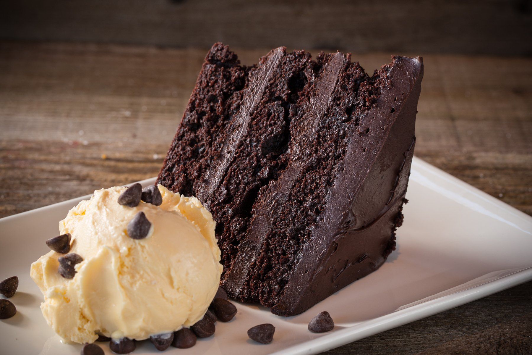 A picture of a chocolate cake and ice cream
