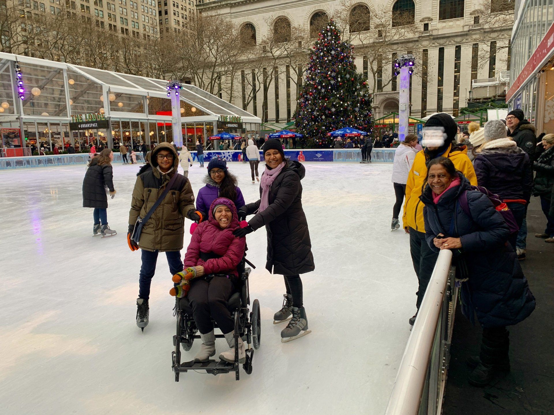 It's a festive scenery with the glass enclosed Lodge foodcourt in the background as well as the famous Christmas Tree. It was a gloomy morning which makes it look like early evening.  Wheelchair accessible activities in New York City is the best.