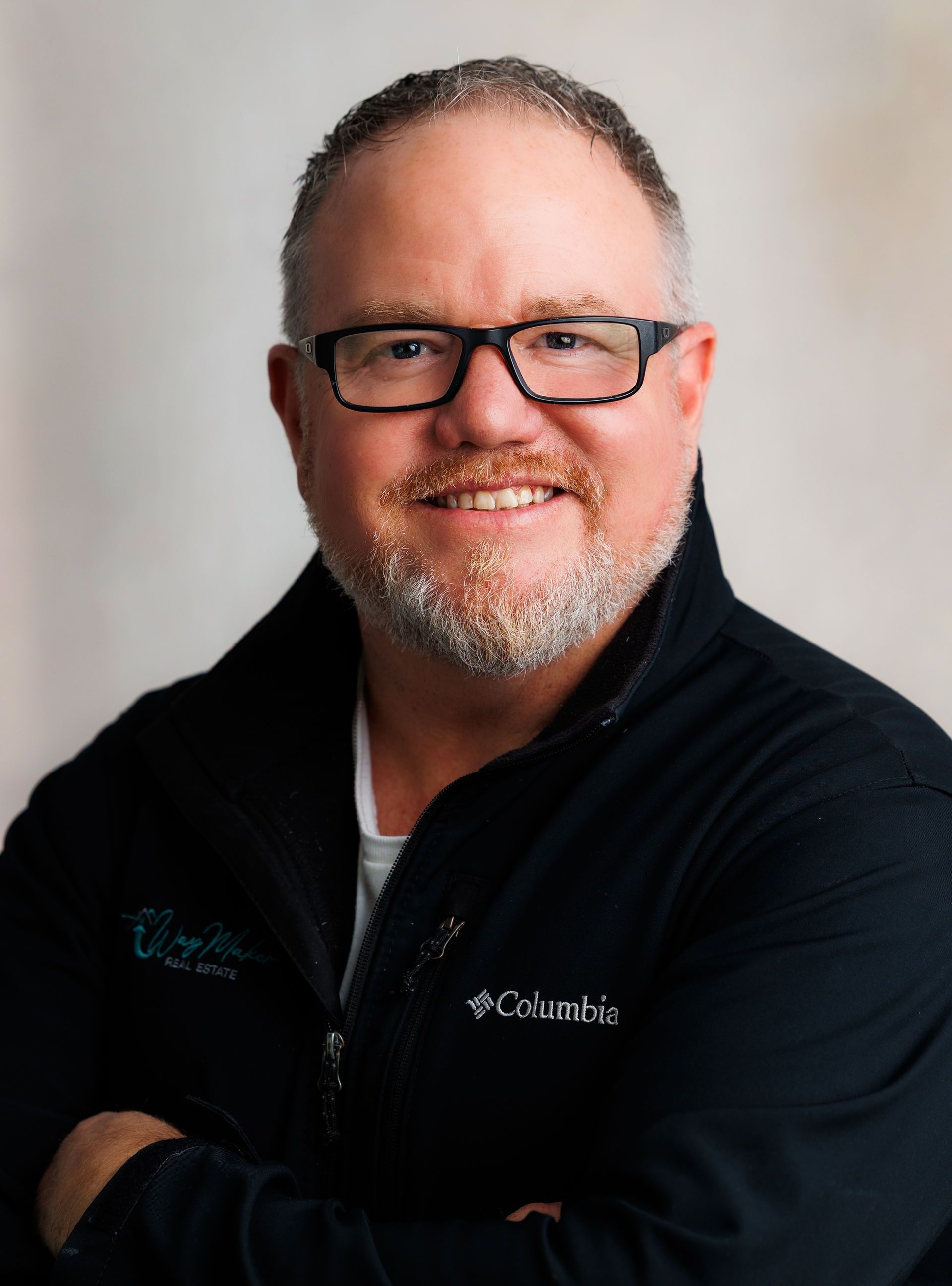 Mike Ross posing for a picture and smiling for the camera