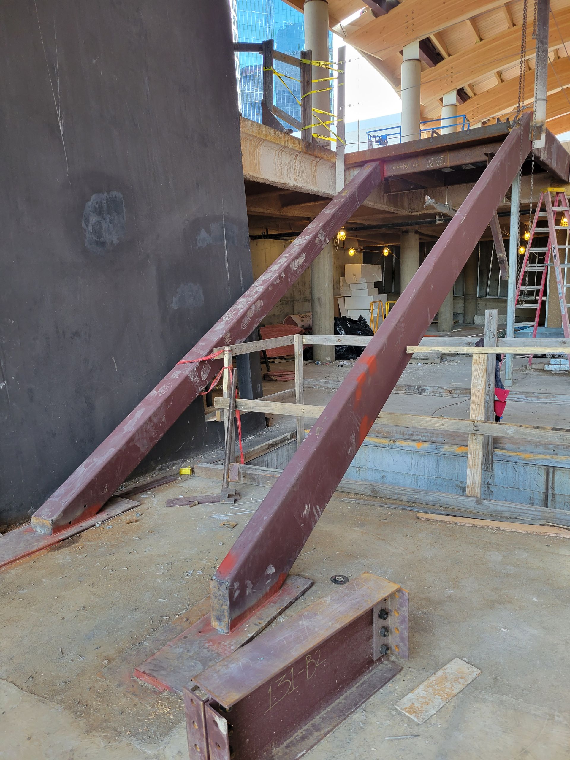 A staircase is being built in a building under construction.