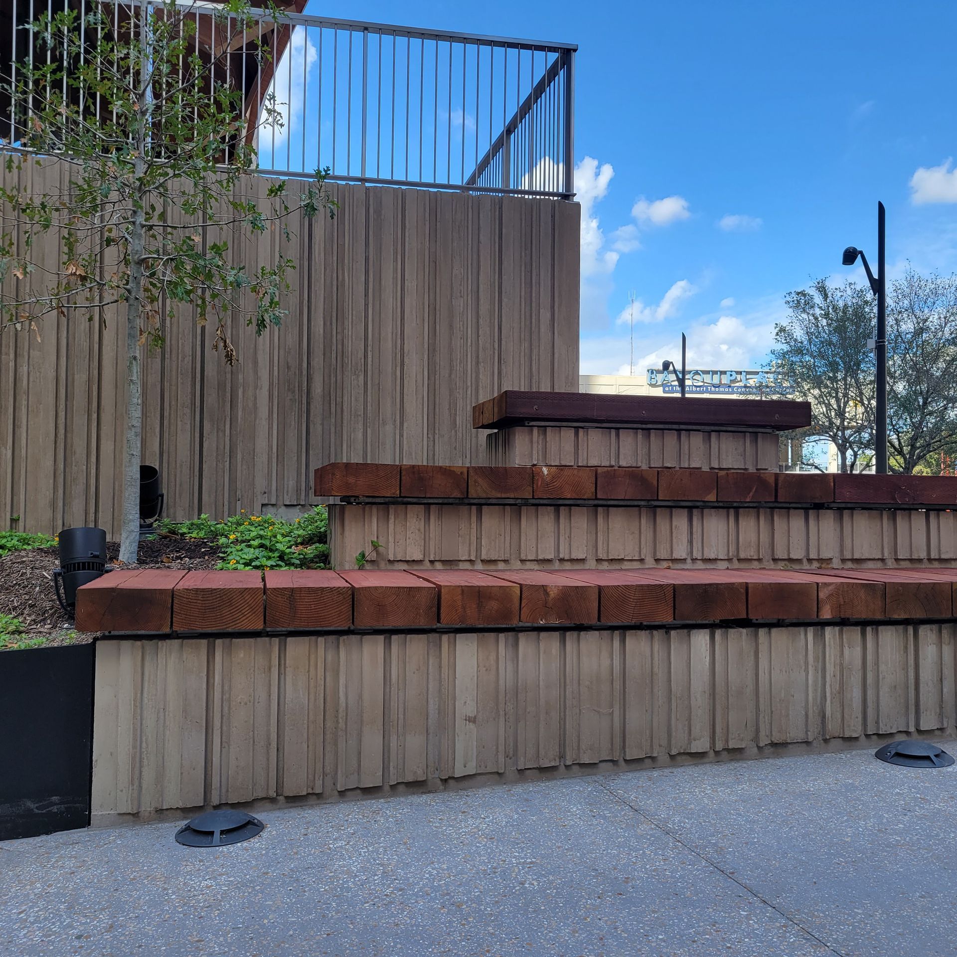 A wooden fence with steps leading up to it