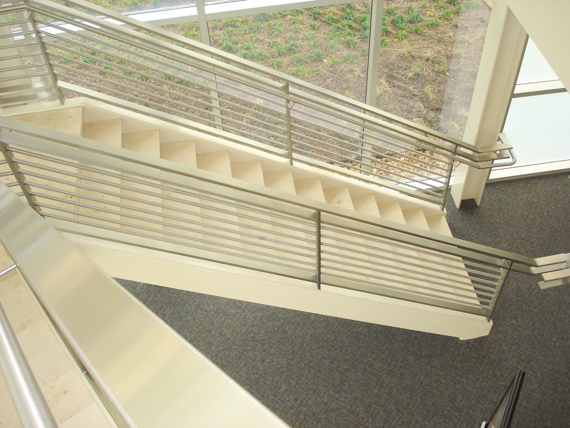 An aerial view of a staircase with a metal railing
