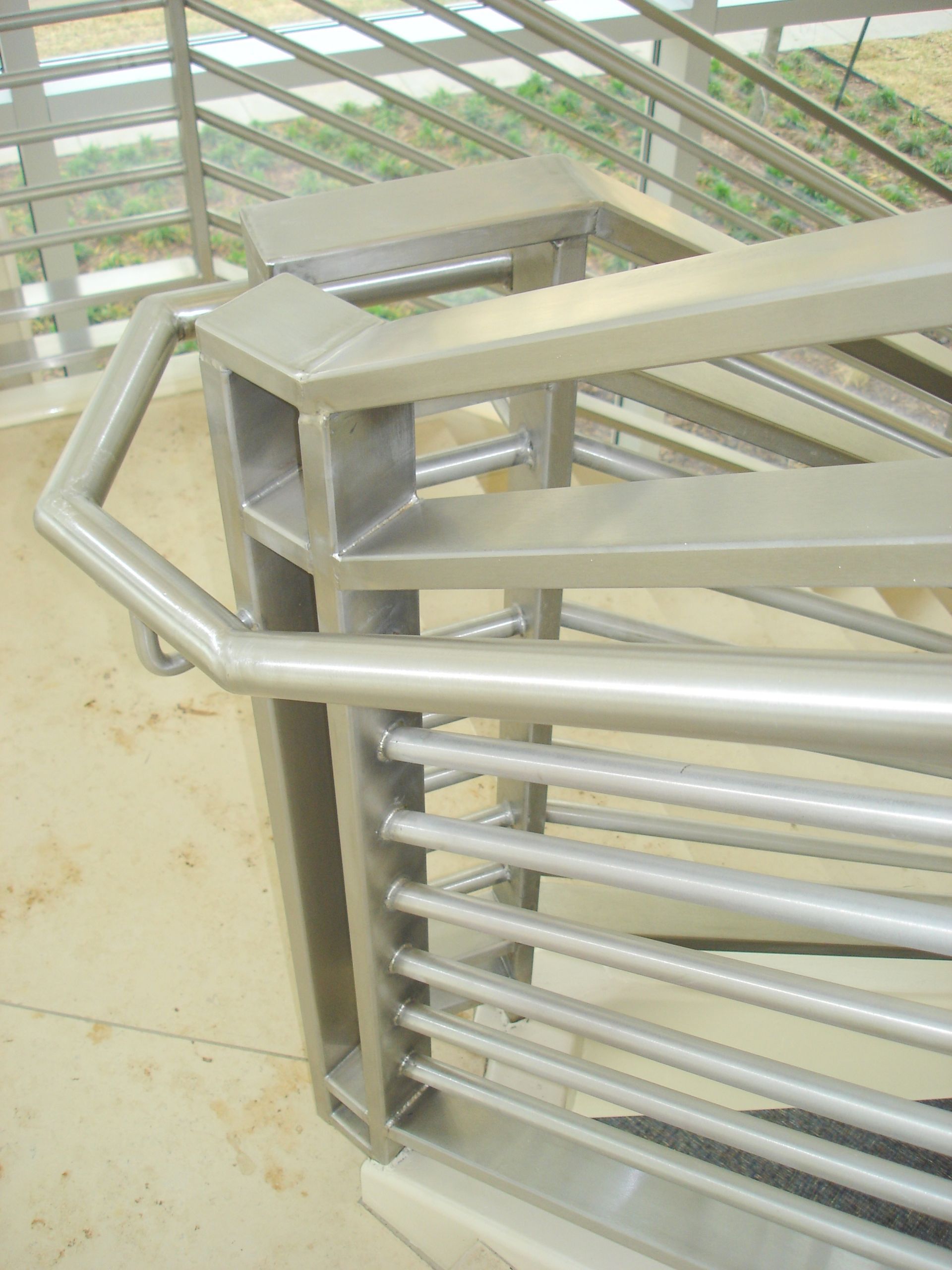 A close up of a metal railing on a staircase