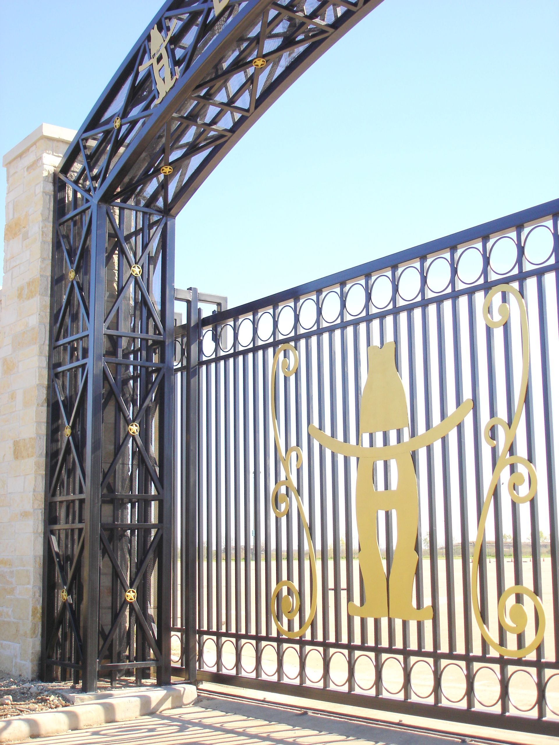 A fence with a cowboy and a bottle on it