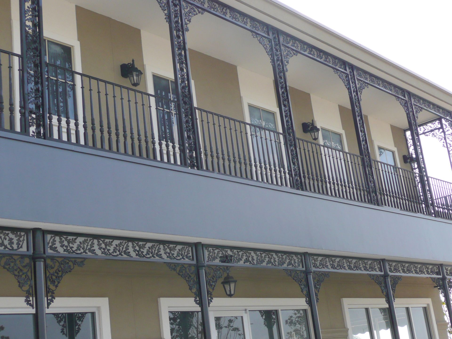 A building with a balcony and a wrought iron railing