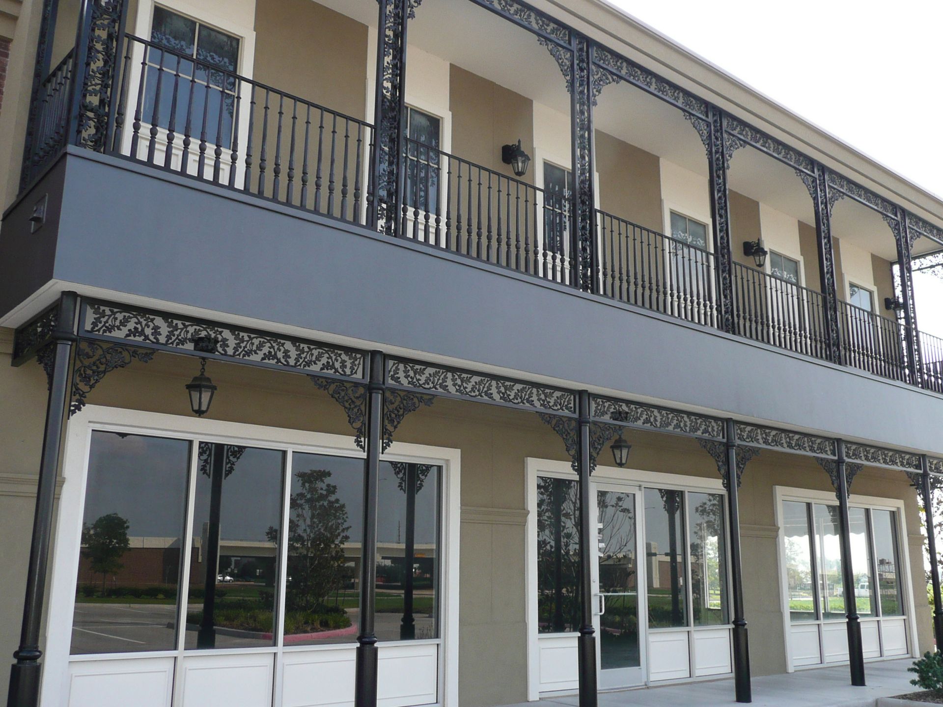A large building with a balcony and lots of windows