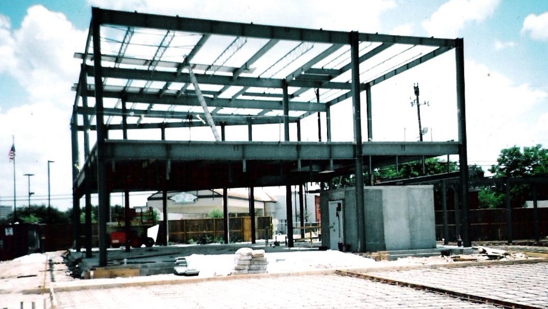 A building under construction with a lot of metal frames
