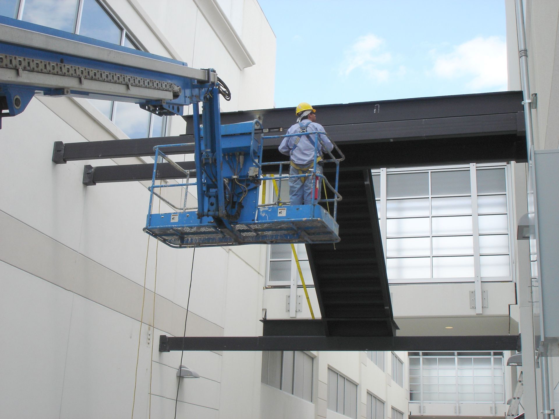 A man on a lift with the number 3 on it