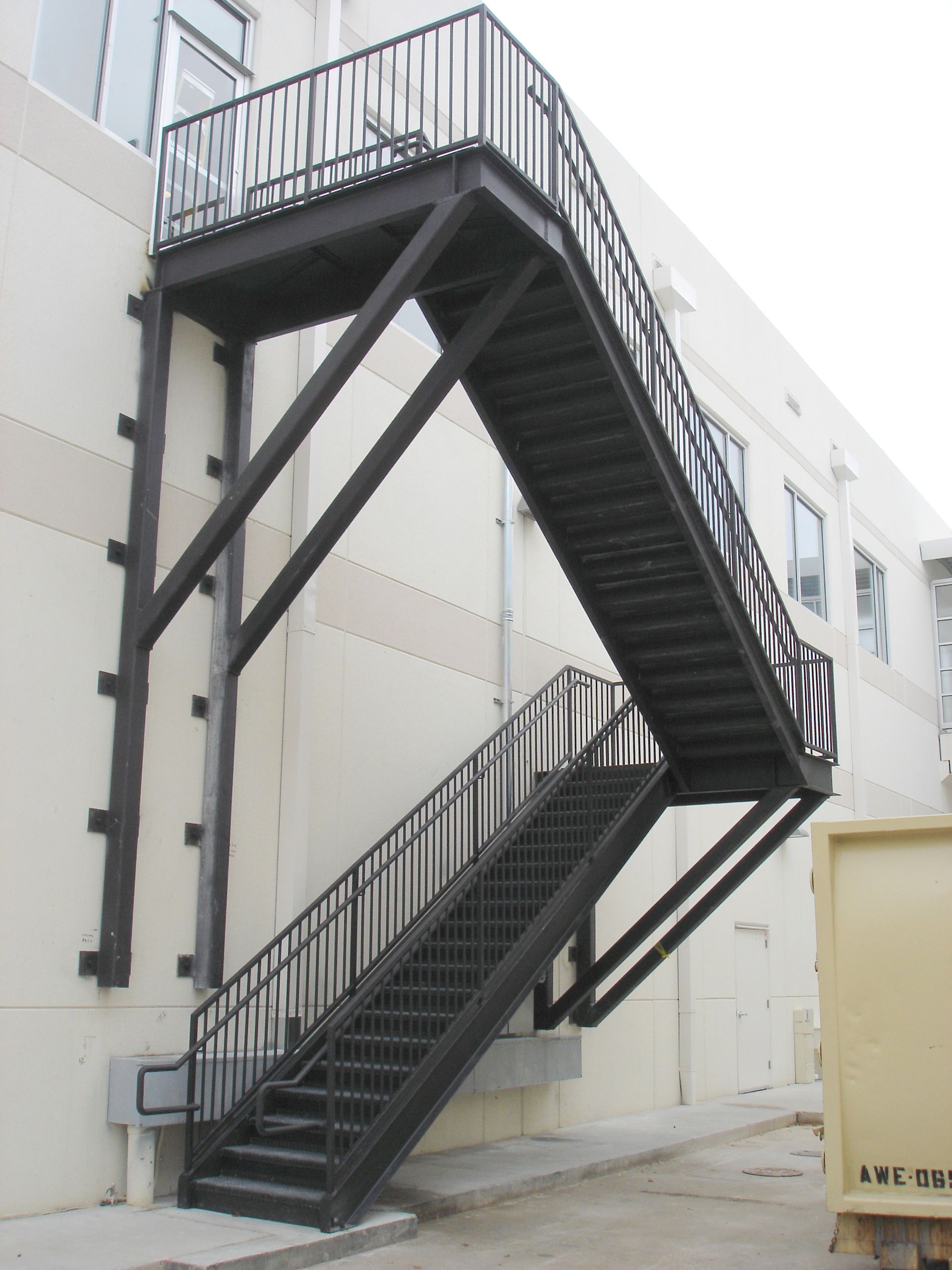 A fire escape is attached to the side of a building
