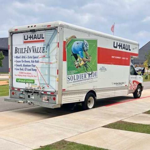 U-Haul moving truck parked on a driveway, featuring