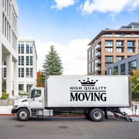 Moving truck parked on city street; logo