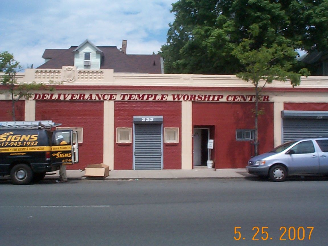 A van is parked in front of the deliverance temple worship center