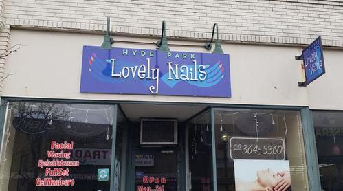 A lovely nails store front with a purple sign