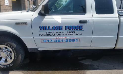 A white truck with village force structural steel fabrication and erection written on the side