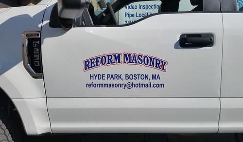 A white truck with the words reform masonry on the side of it.