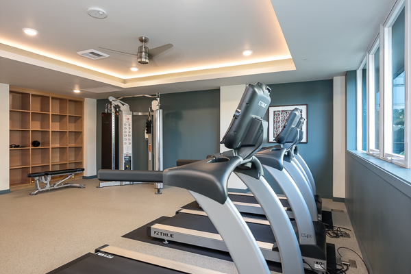 Photo of the gym, featuring treadmills and more