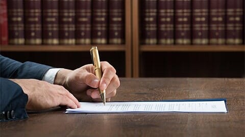Lawyer Signing In A Legal Paper — Attorney in Columbus, OH