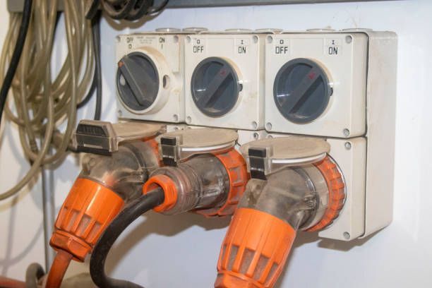 A row of electrical outlets with switches on them