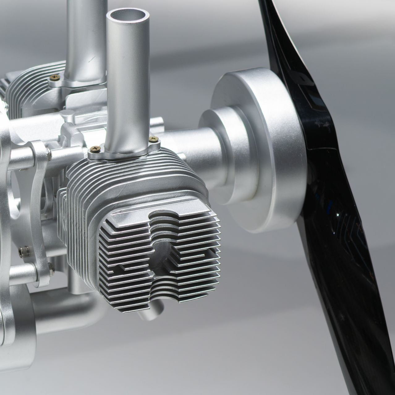 Forklift carrying pallet of goods in a warehouse. Yellow forklift, blue and white goods.