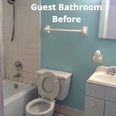 A patio with a lot of furniture and lights at night.