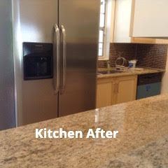 A stainless steel refrigerator sits next to wooden cabinets and a granite countertop in a renovated kitchen.