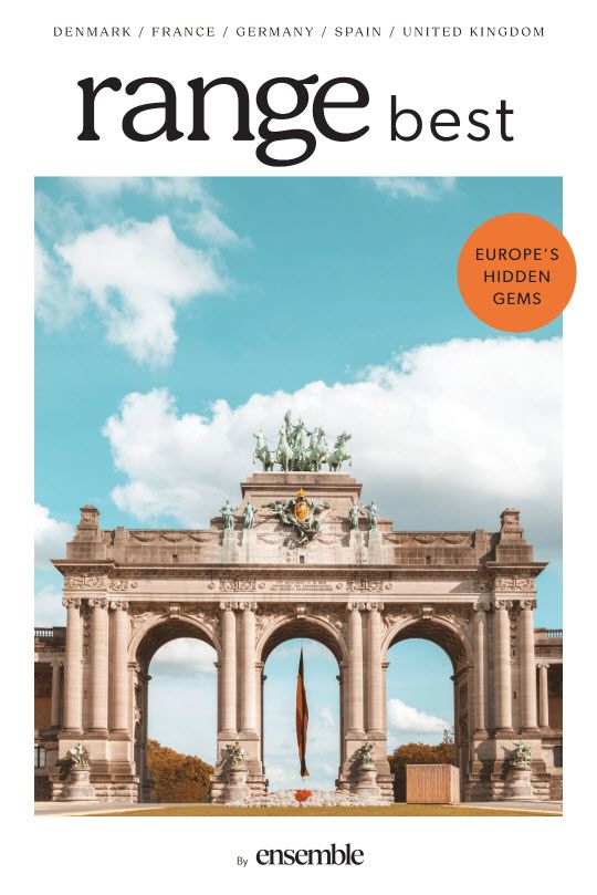 The cover of a magazine with a picture of a building on it.