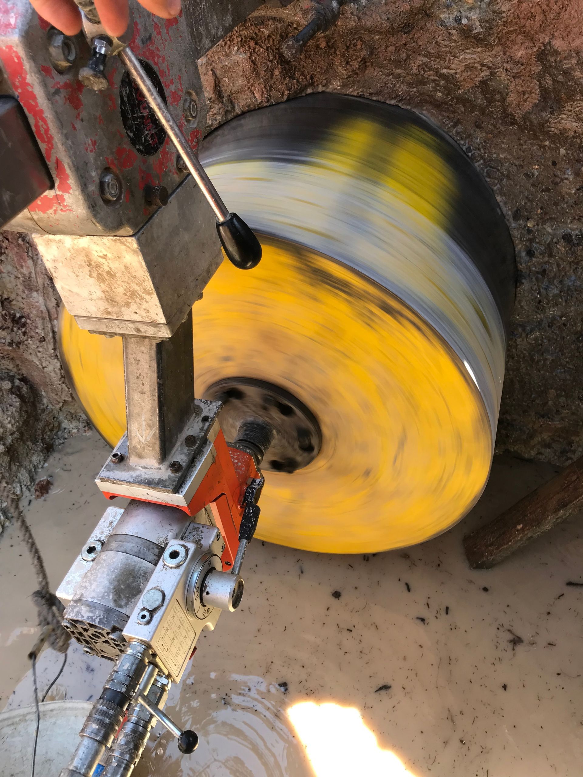 Using A Machine To Cut A Hole In The Floor Of A Building — Newcastle Cut N Drill Pty Ltd In Boolaroo, NSW
