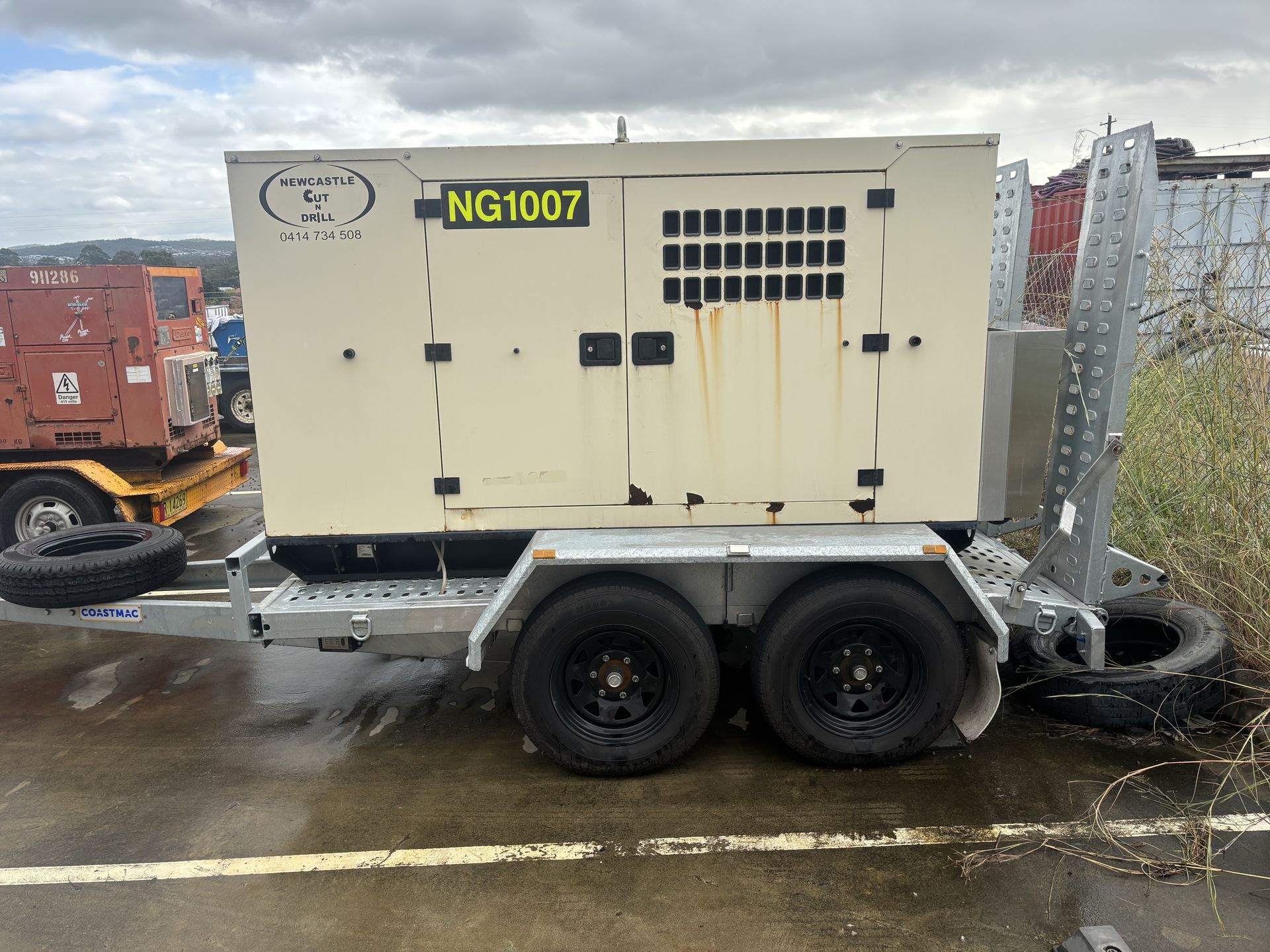 A cream mobile generator — Newcastle Cut N Drill Pty Ltd In Boolaroo, NSW