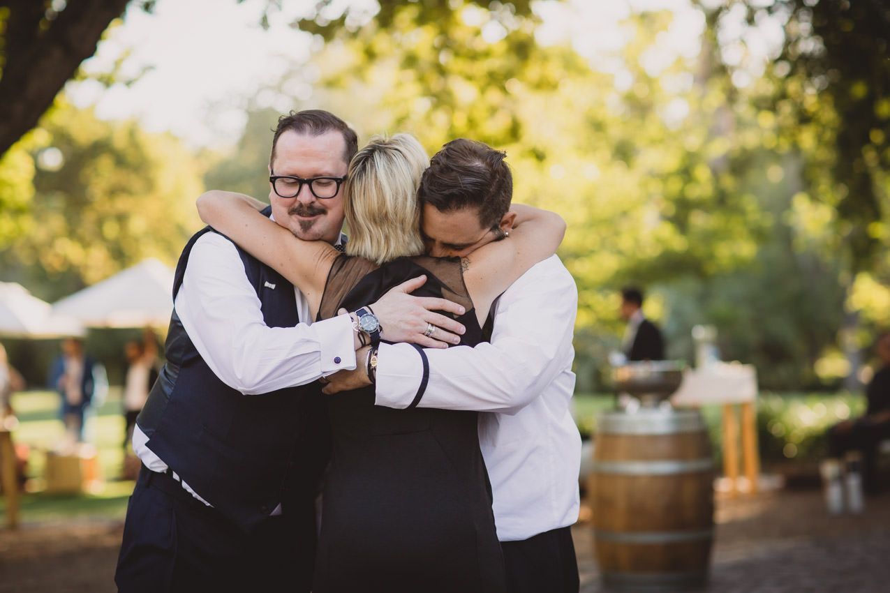 A group of people are hugging each other in a circle.