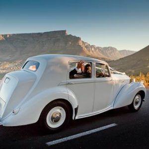 A large building with a fountain in front of it