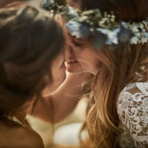 A dining room with tables and chairs and a view of a city.