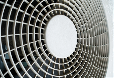 A close up of a fan with a circular pattern on it