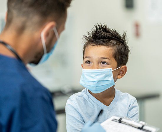 Young Boy Wearing A Mask — Cheektowaga, NY — Century-Airport Pediatrics, P.C.