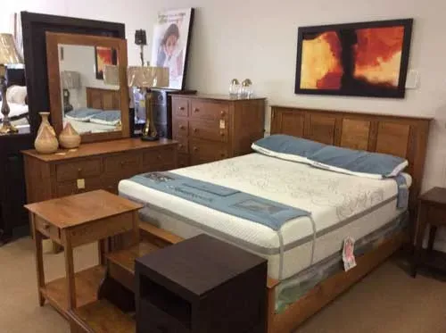 White mattress with blue pillows — Livonia, MI — Chris Furniture