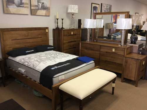 Black pillows in white mattress — Livonia, MI — Chris Furniture
