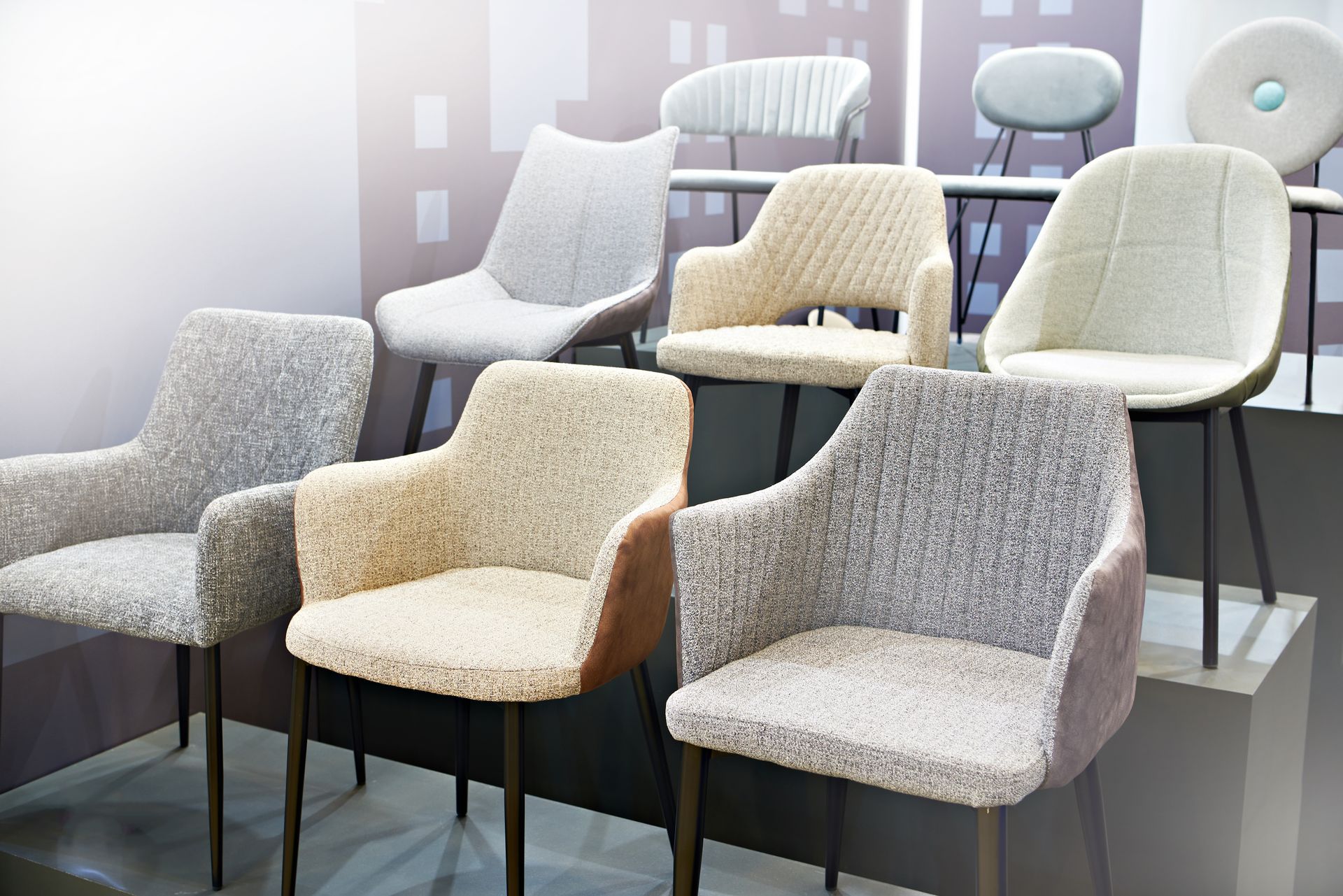 Rows of elegant and modern chairs on display, inside a furniture store. Rows of elegant and modern chairs on display, inside a furniture store.