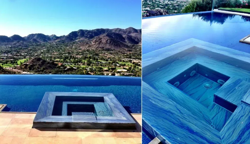 A white vase with greenery on a kitchen countertop. The background is a blurry kitchen.