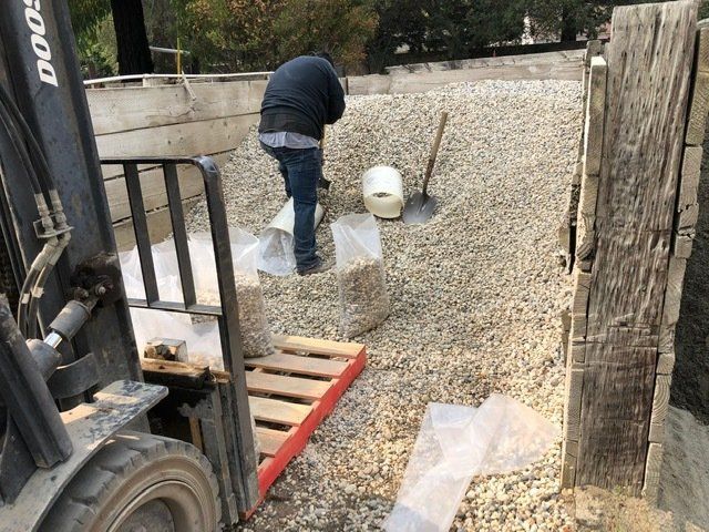 Man Shoveling Gravel — Martinez, CA — MacAlvey's Nursery And Landscape Material