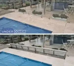 Pool cover retracts to reveal a pool, set in a stone patio with outdoor furniture.