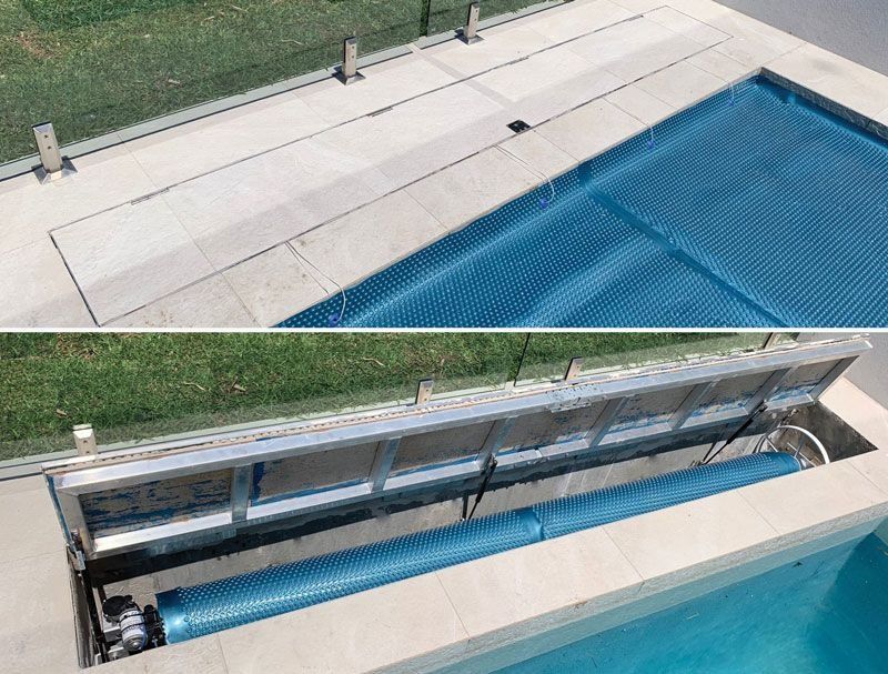 Pool with a blue cover, partially retracted into a hidden compartment in the pool deck.